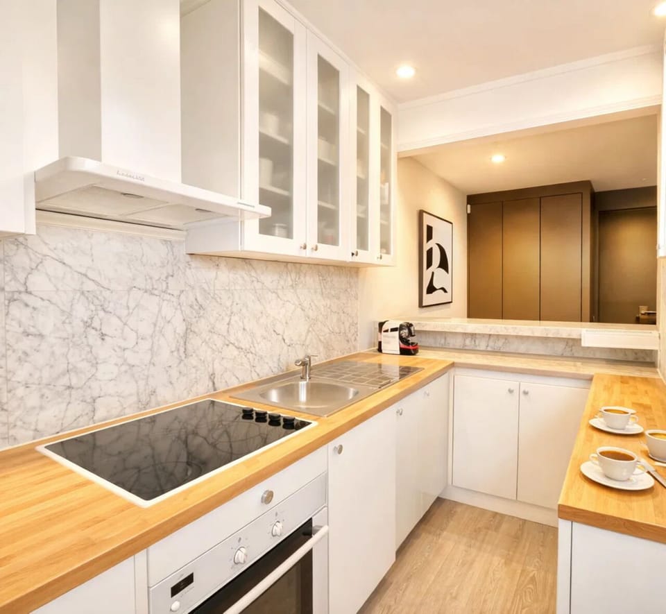 Deluxe Apartment, Courtyard View | Private kitchen | Espresso maker, electric kettle