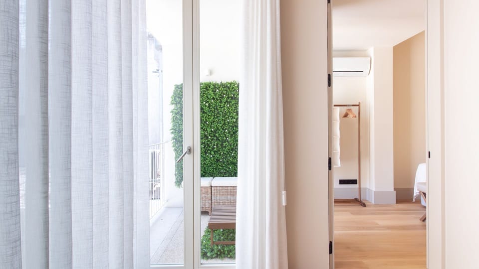 Step into serenity with this inviting private terrace, just beyond the soft, flowing curtains. Perfect for relaxing or enjoying a quiet moment outdoors. #OutdoorOasis #SereneSpaces #PrivateTerrace