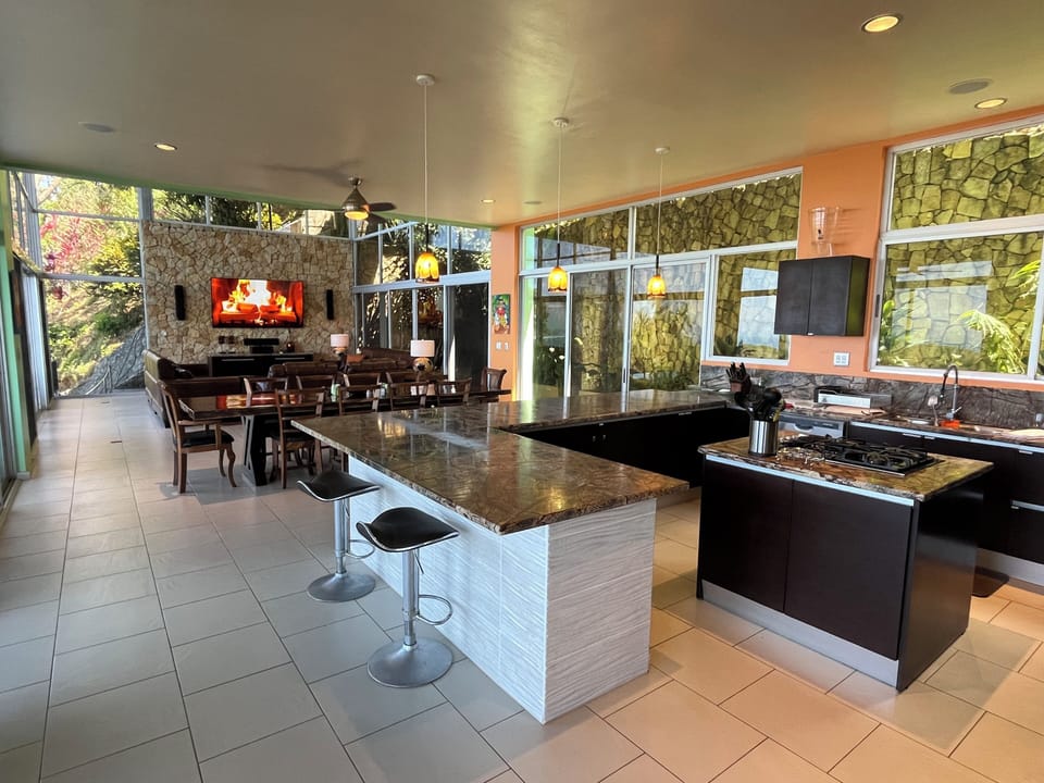 Adjacent to the main level terrace is a spacious open-concept kitchen/dining/great room.