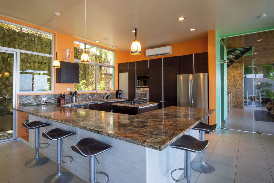 The fully functional kitchen with stove, oven, microwave, dishwasher and every appliance needed.