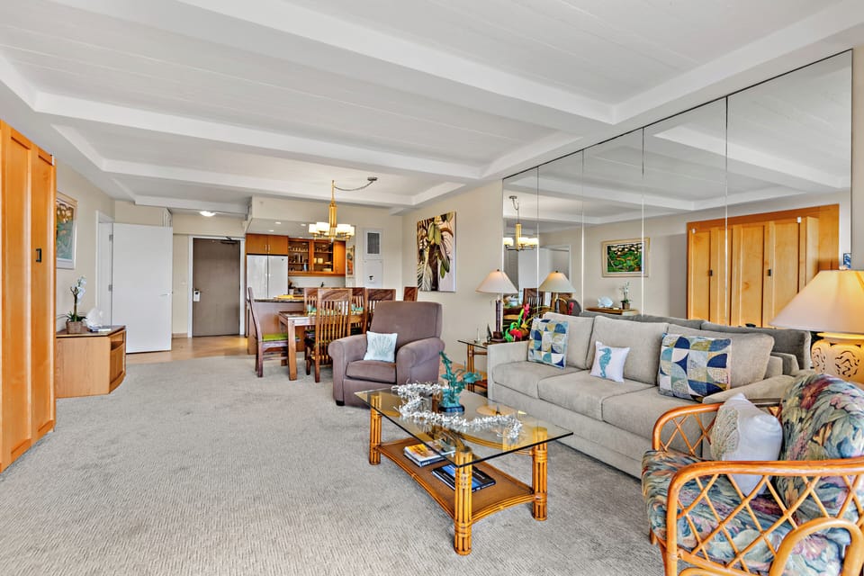 Unwind in a bright and welcoming living area, complete with a flat-screen TV and comfortable furnishings. Perfect for peaceful lounging.