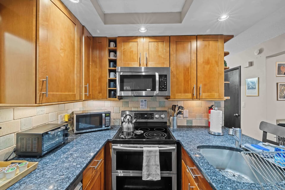 Sleek cabinetry and modern appliances invite culinary adventures in style!