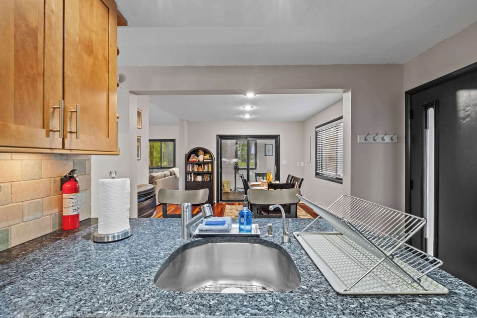 Stylish granite countertops and modern fixtures make cooking a breeze! Enjoy the open layout!