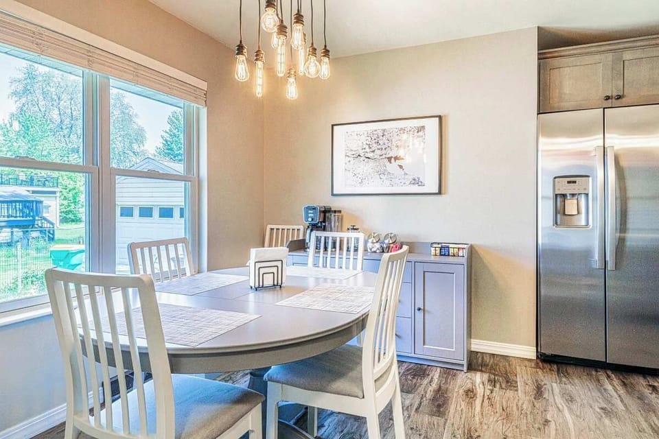 Spacious dining table with seating for up to 6—perfect for family meals, game-day feasts, or relaxing after a day at Lambeau Field. Comfortable, stylish, and designed for gathering.