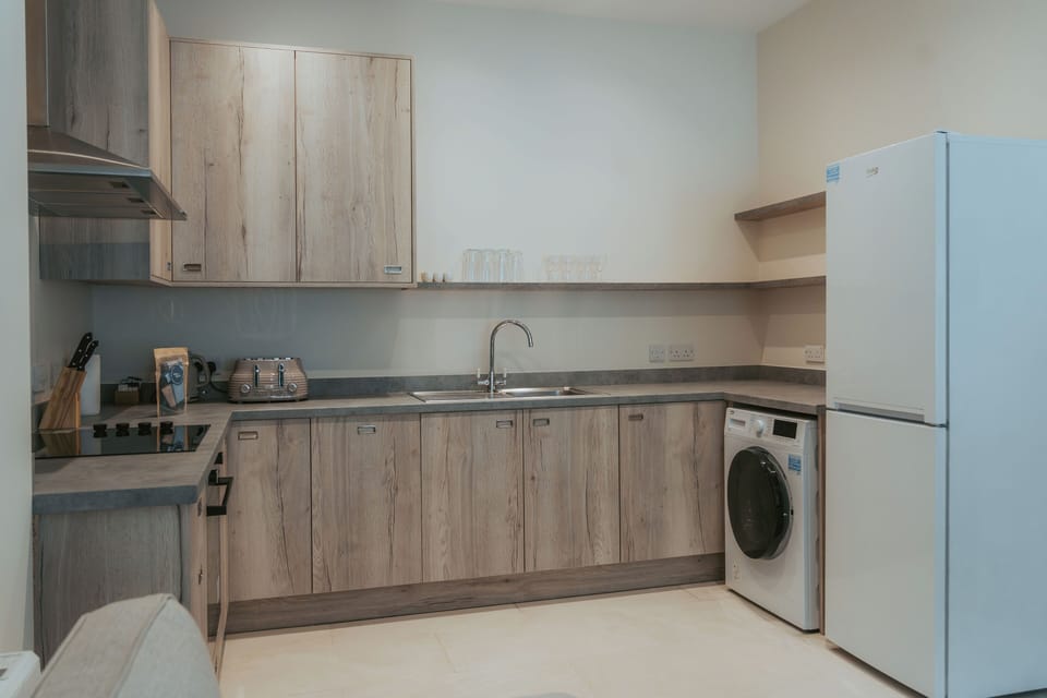 Apartment | Private kitchen | Electric kettle, dining tables