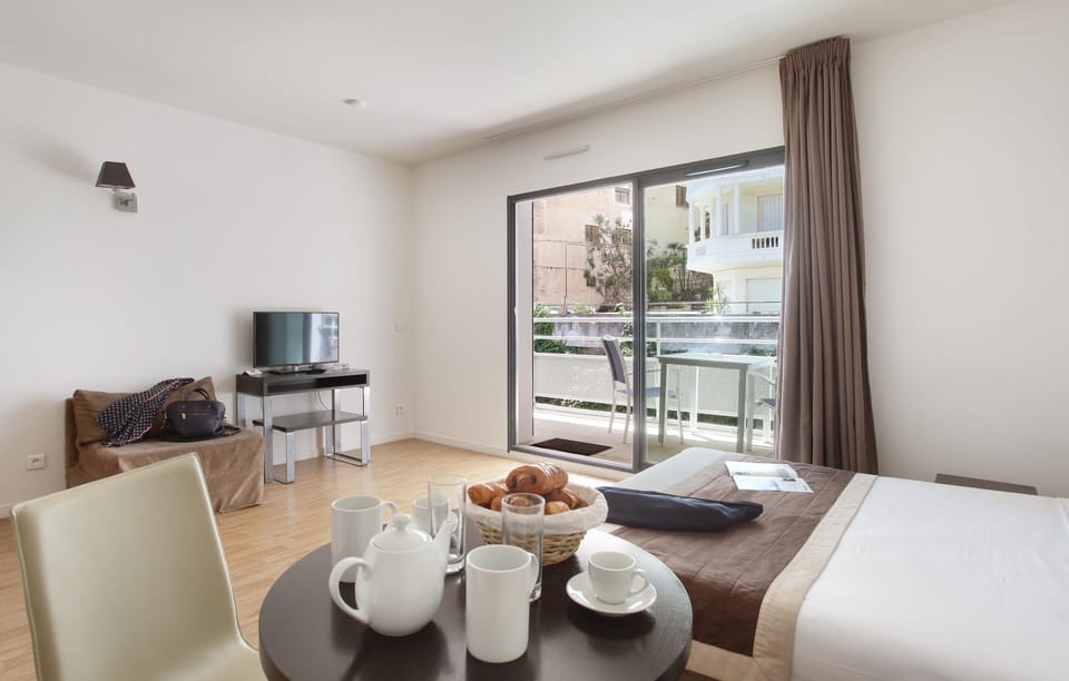Start your day here with a light breakfast or unwind over a simple meal at the table.