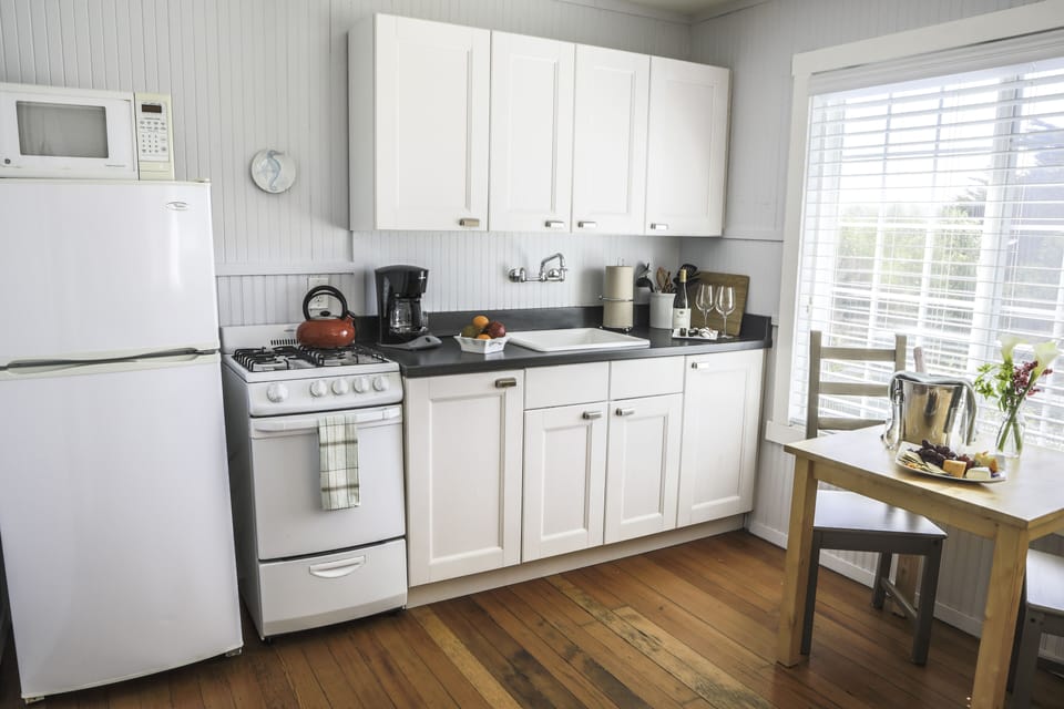 Heather Cottage | Private kitchen | Coffee/tea maker, microwave, highchair