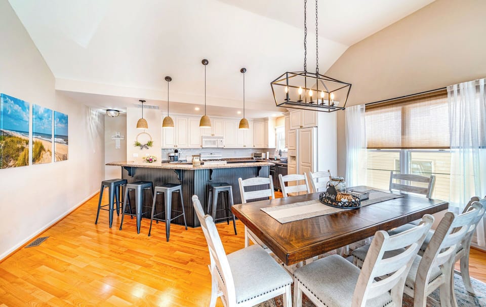Modern kitchen with an adjacent dining table for gatherings.