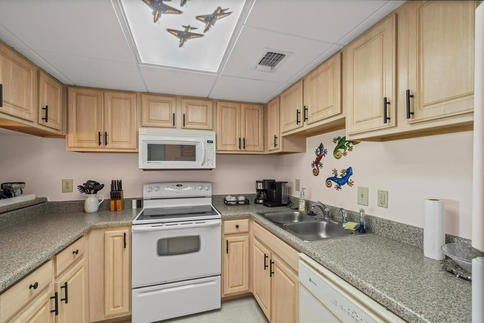 Well-equipped kitchen with modern appliances and ample cabinet space.