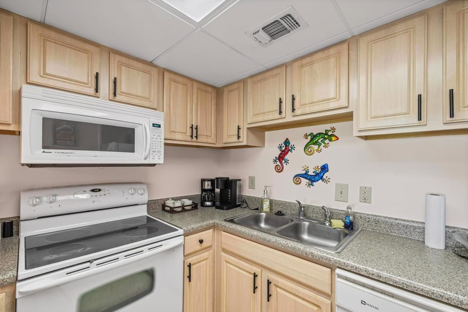 Fully-equipped kitchen with modern appliances and ample counter space.