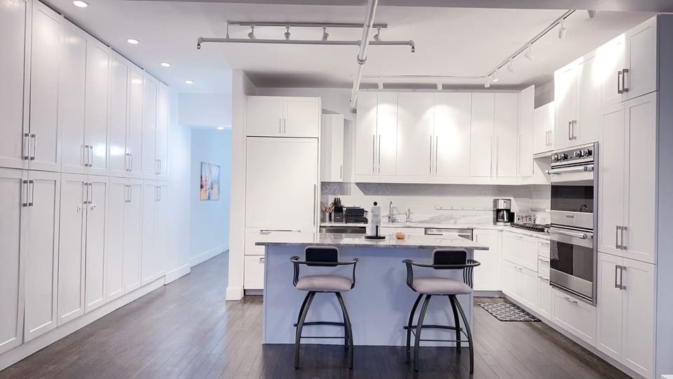Gourmet kitchen with marble countertop, high-end appliances