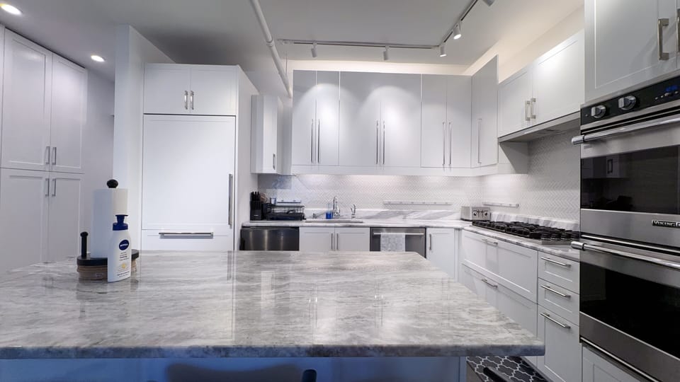 Gourmet kitchen with marble countertop, high-end appliances