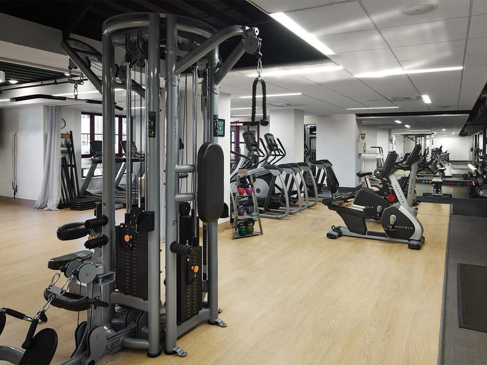 Fitness center with lockers, showers, steam, and sauna rooms