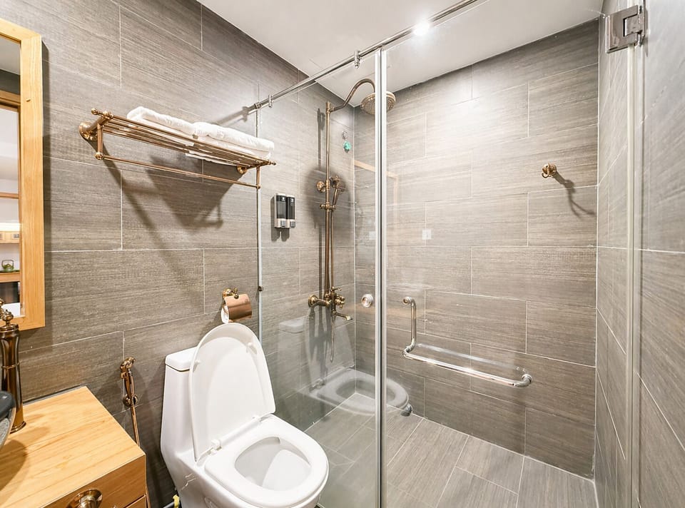 Shower, rainfall showerhead, designer toiletries, hair dryer