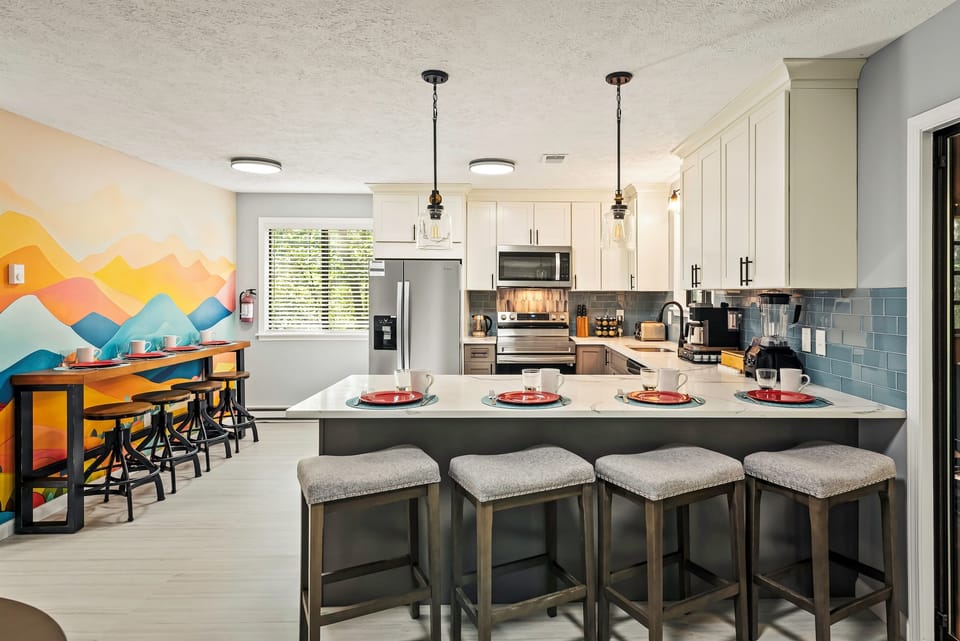Gourmet Kitchen: Bright, inviting space with modern appliances and stylish seating for culinary adventures!