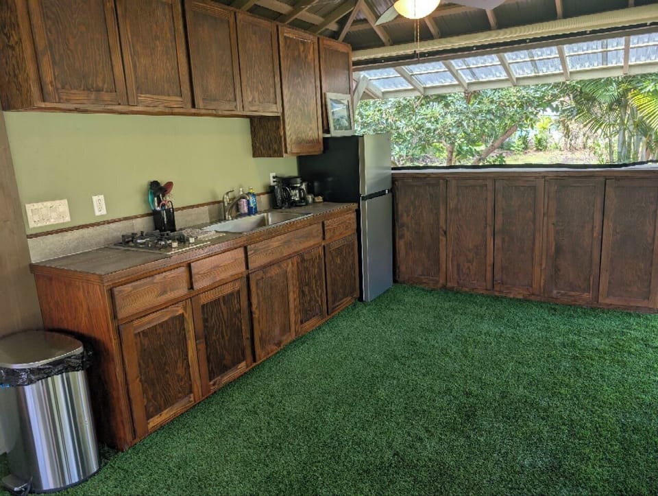 Kitchen includes refrigerator, two-burners, coffee maker, hot water kettle, etc.