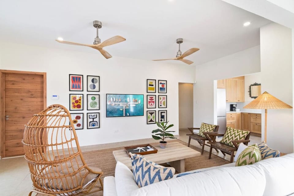 Indulge in comfort and entertainment in this villa`s spacious living room, complete with a large TV. With plush seating and stylish decor, this is not just a room; it`s a sanctuary for relaxation and shared moments.
