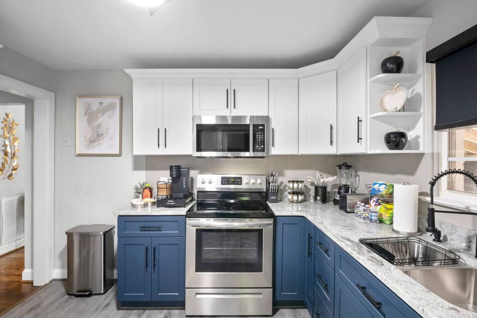 Fully Stocked Kitchen + Coffee Nook! Hooray!Granite counters, intimate bar seating, and all your cooking essentials—plus a cozy coffee nook and washer/dryer combo for convenience, helping you get things D-O-N-E!