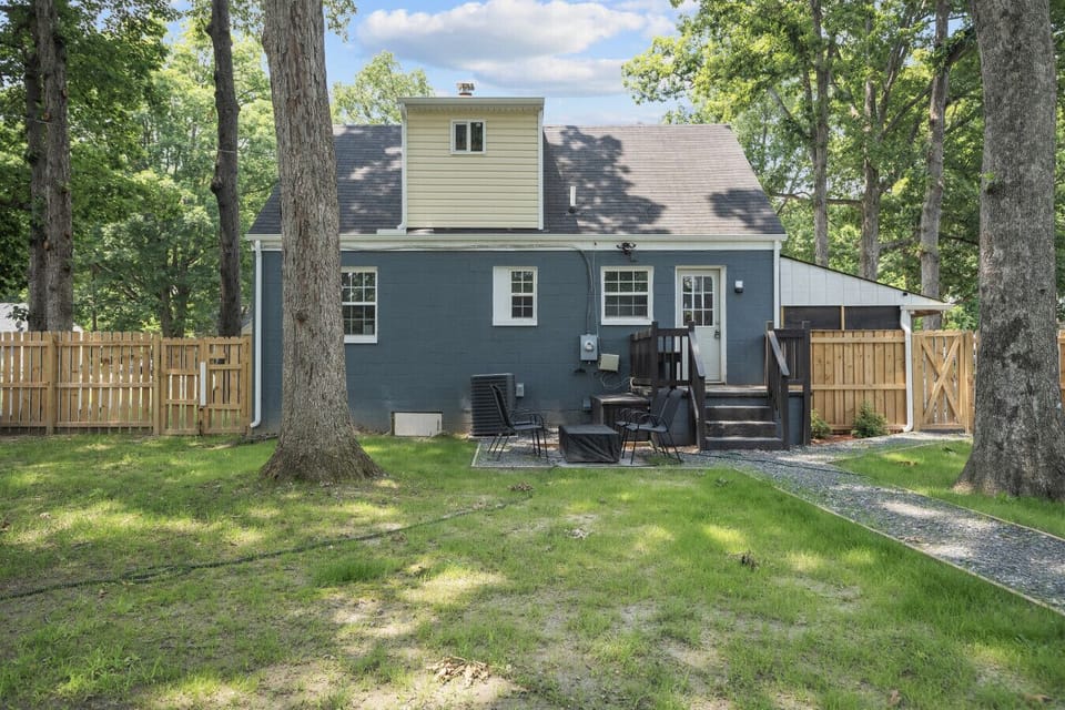 Enjoy a Family-Friendly Fenced Backyard! Fully fenced yard with swing set, basketball hoop, fire pit, seating areas, grass + gravel space, horseshoe games for all abilities, and a custom indoor kids` playhouse in the shed!