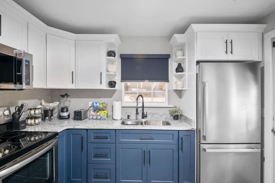 Fully Stocked Kitchen + Coffee Nook! Hooray!Granite counters, intimate bar seating, and all your cooking essentials—plus a cozy coffee nook and washer/dryer combo for convenience, helping you get things D-O-N-E!
