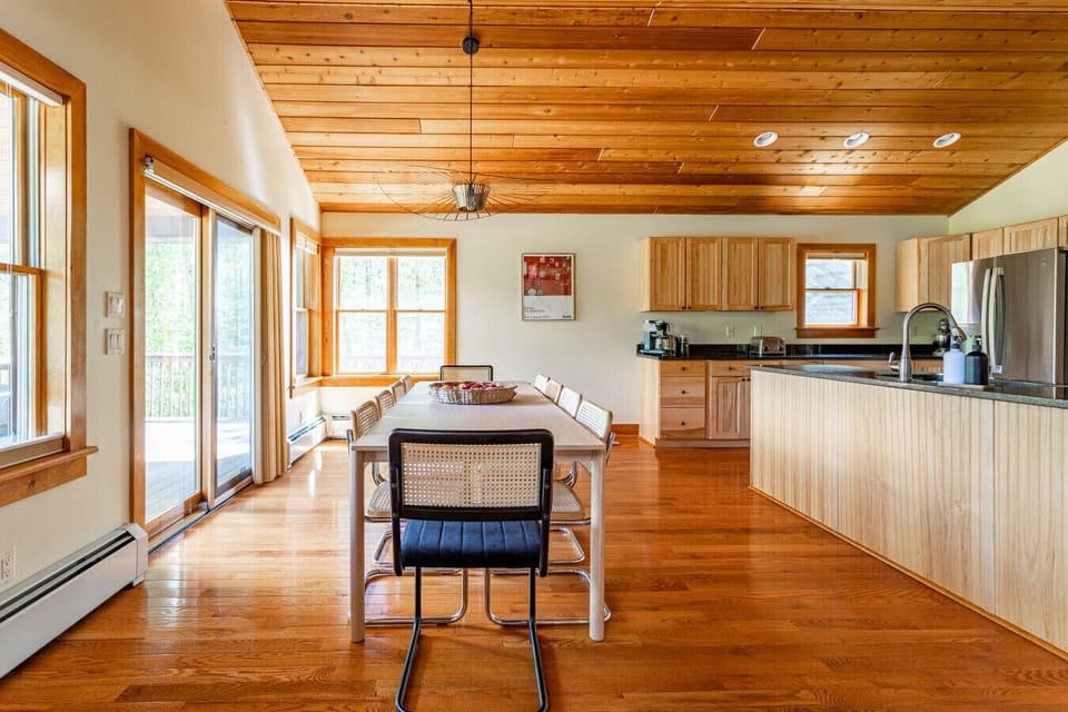 Beautifully bright dining room has back deck access