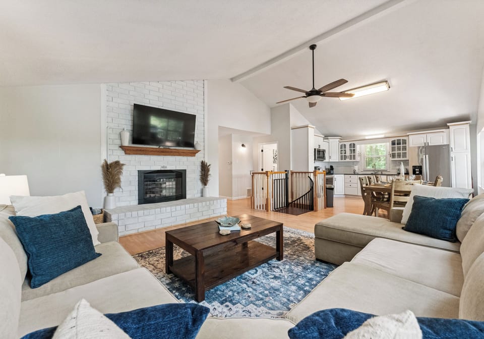 Living room's fireplace and smart TV—perfect for relaxing after a day by the lake.