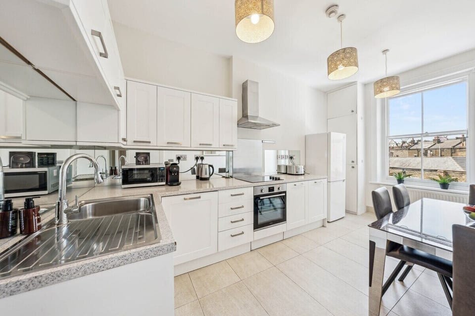 Fully equipped kitchen with modern appliances, cookware, and utensils—perfect for whipping up anything from a quick breakfast to a full dinner. Bright, clean, and ready for your stay.
