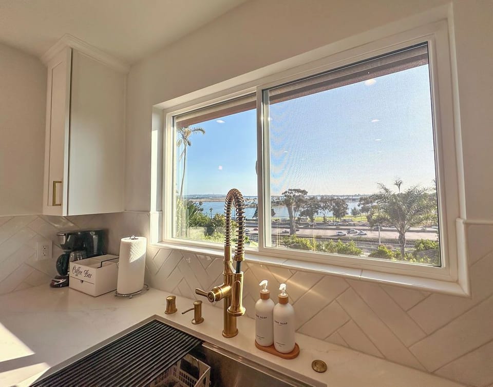 Kitchen sink with high-end fixtures and a great view.