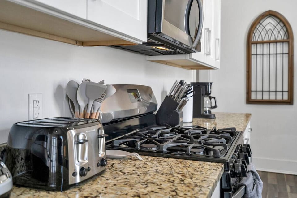 Fully-equipped & stocked kitchen w/ stainless steel appliances (gas oven/stove, microwave, dishwasher, refigerator/freezer), drip & Keurig coffee, toaster, electric kettle, and bar & cafe table seating.