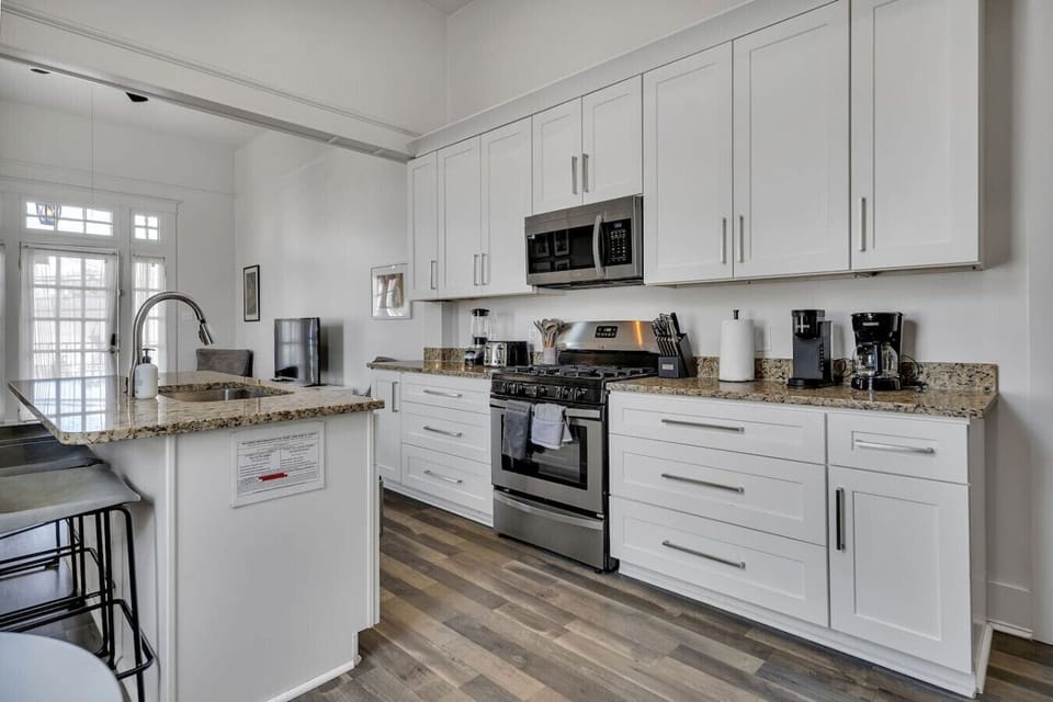 Fully-equipped & stocked kitchen w/ stainless steel appliances (gas oven/stove, microwave, dishwasher, refigerator/freezer), drip & Keurig coffee, toaster, electric kettle, and bar & cafe table seating.