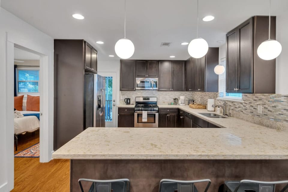 Kitchen space (open concept with living room area).  Fully outfitted with everything you need to whip up a meal!