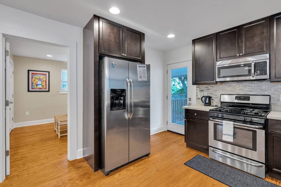Kitchen space (open concept with living room area).  Fully outfitted with everything you need to whip up a meal!  Stainless steel appliances (gas stove, dishwasher, microwave, refrigerator)