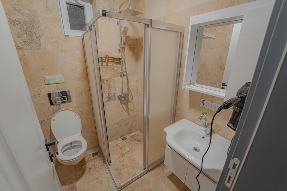Economy Double or Twin Room | Bathroom | Shower, hair dryer, towels, soap