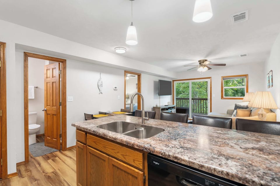 The open kitchen offers ample space & every home comfort