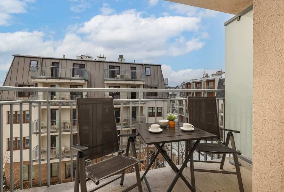 The balcony provides a perfect spot for enjoying the fresh air. 