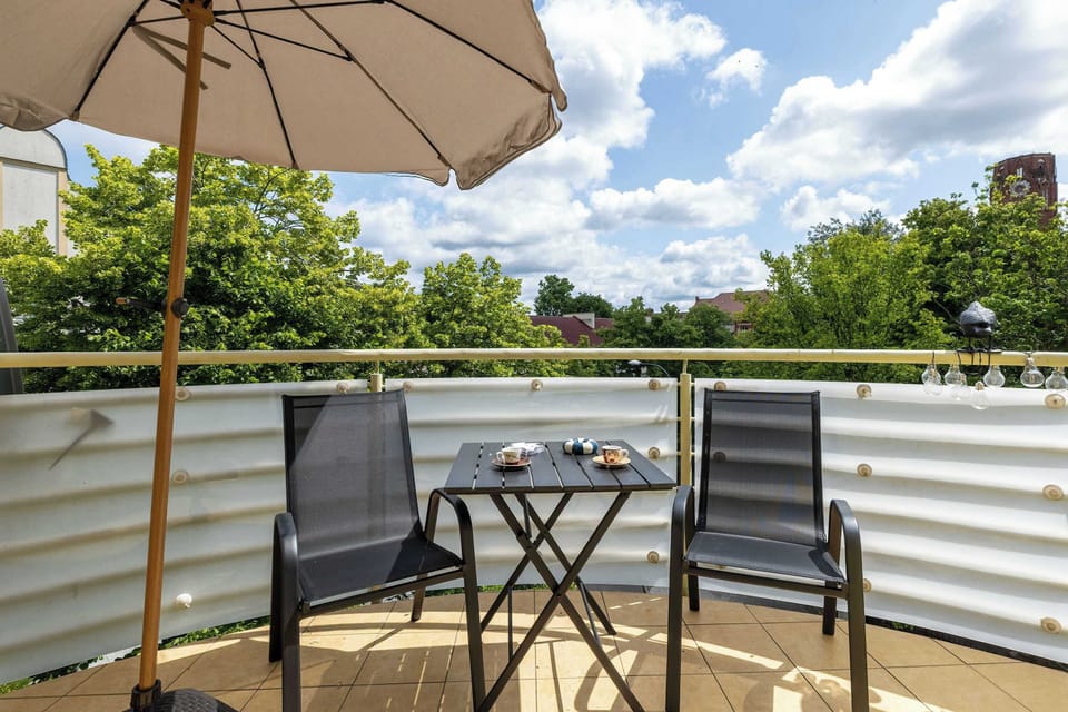The balcony provides a perfect spot for enjoying the fresh air.