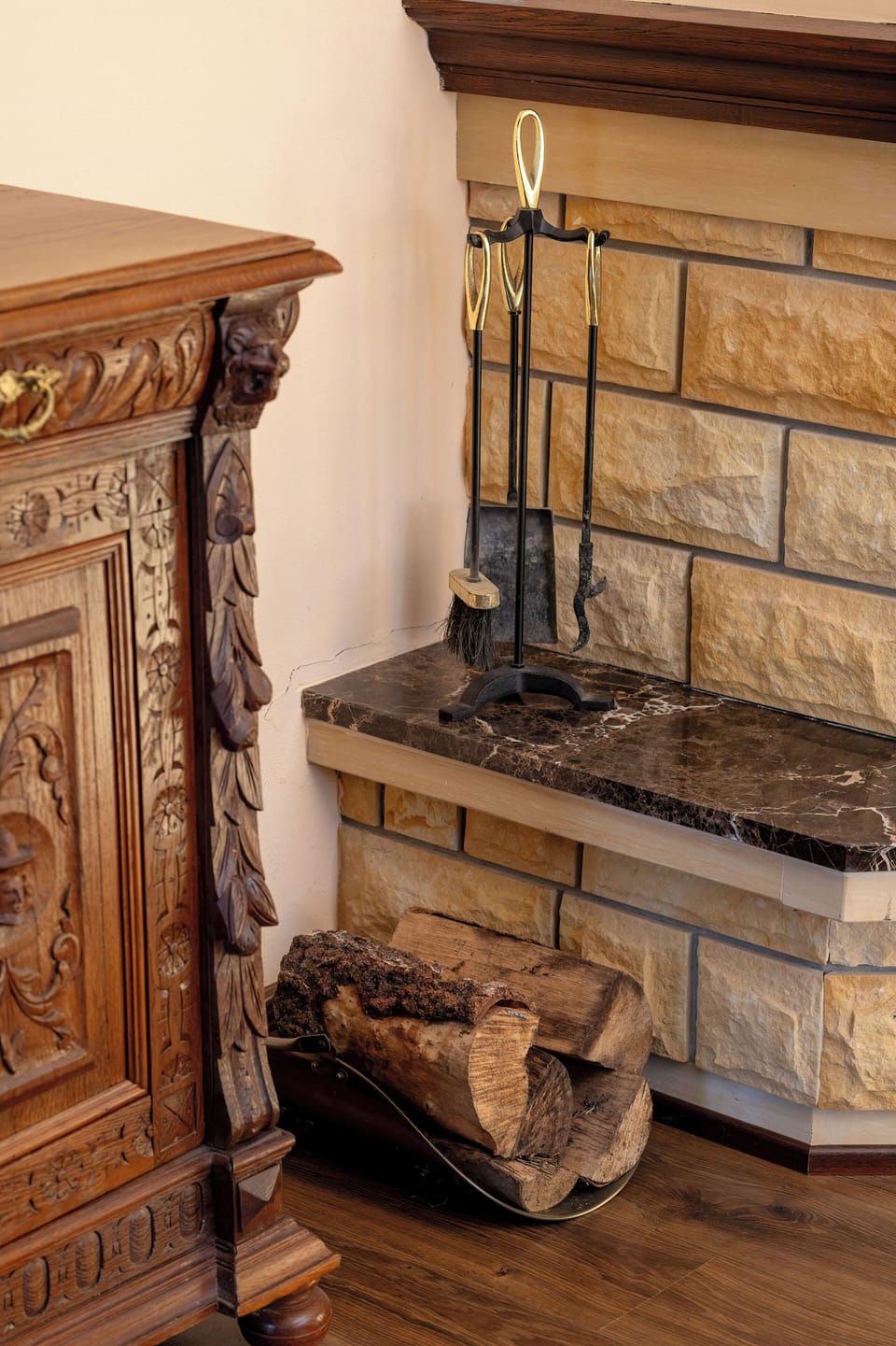 A fragment of a room with a decorative fireplace.
