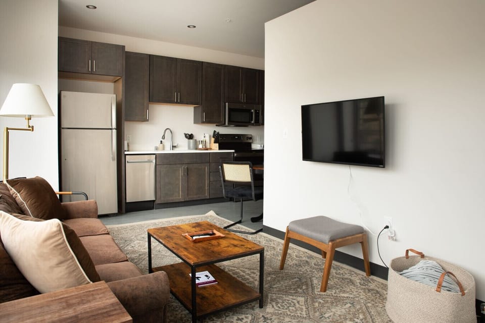 Sun-drenched living area featuring charming architecture and a front-row view of the Fiserv Forum.