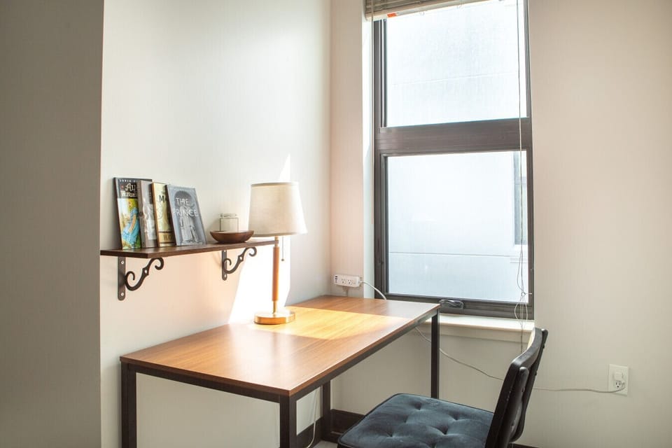 Relax or catch up on emails in this open-concept living space designed for productivity and comfort