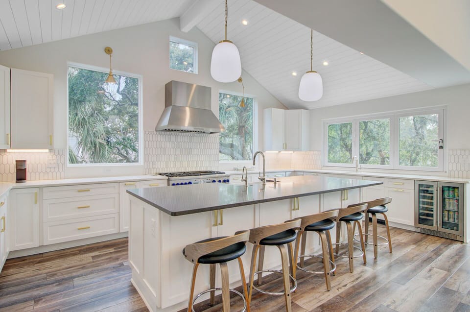Your gourmet kitchen awaits with sleek countertops, modern appliances, and a spacious island perfect for cooking and gathering together.