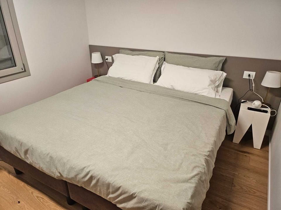 Superior Townhome, City View | Down comforters, minibar, in-room safe, laptop workspace