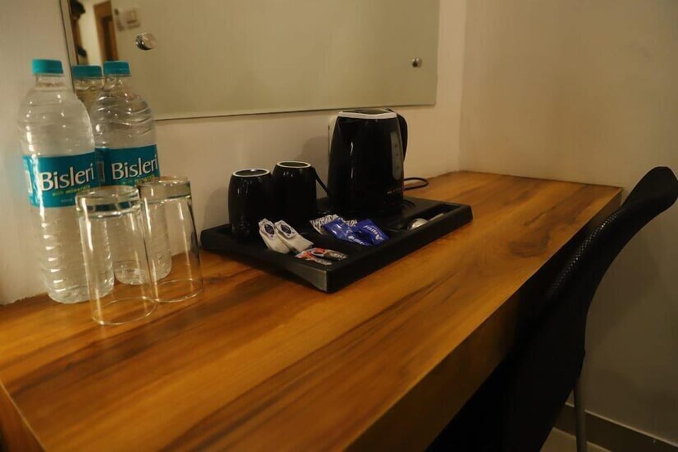 Deluxe Room, Garden View | Desk, laptop workspace, blackout drapes, iron/ironing board