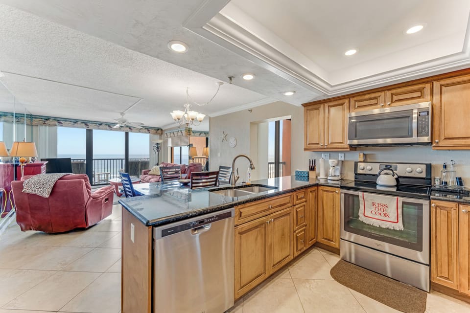Charming kitchen with beautiful tile backsplash and ocean light.