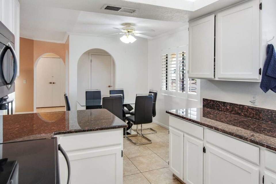Open kitchen with dining area nearby.