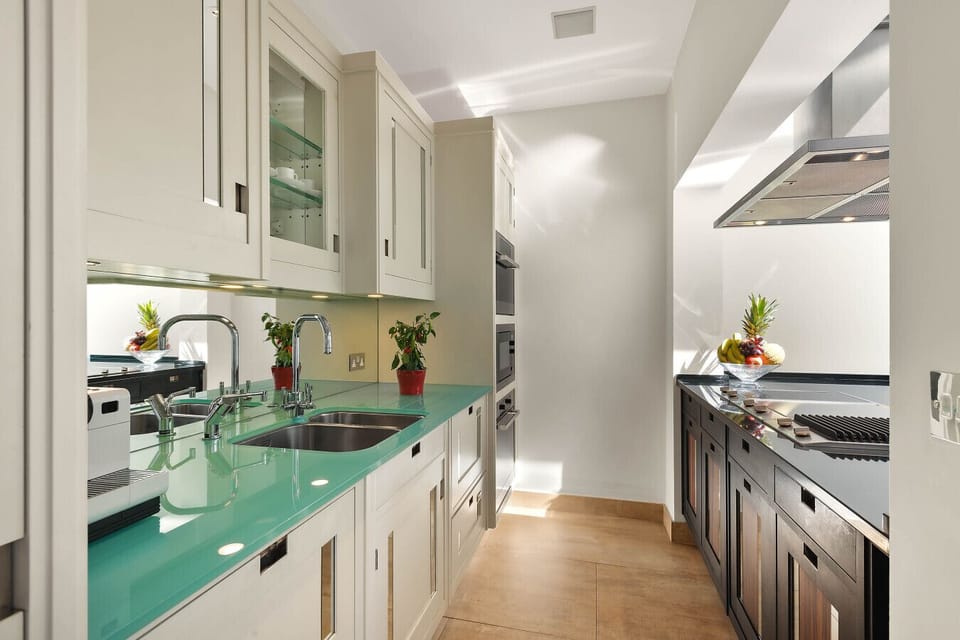 Kitchen | Complimentary Bottled Water | Nespresso Machine + Coffee Capsules |  Olive Oil, Salt, Pepper | Tea & Milk | Dishwasher | Microwave | Oven | Fridge | Freezer | Toaster