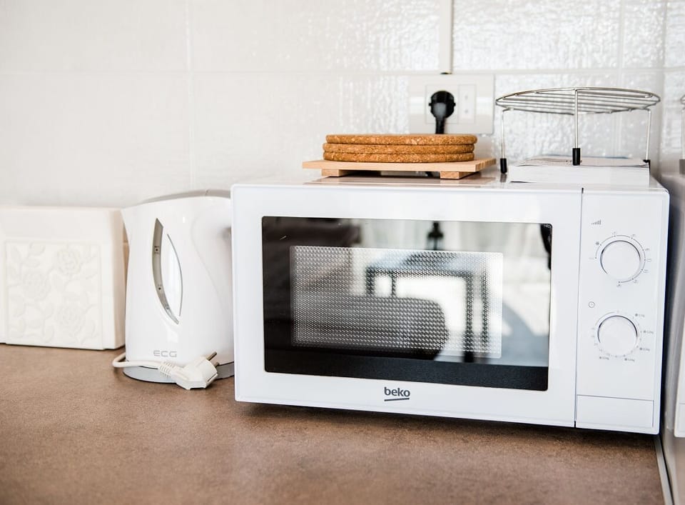 Apartment, Sea View | Private kitchen | Full-size fridge, microwave, oven, stovetop