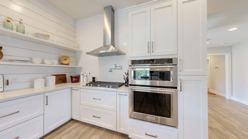 Abundant counter space enhances functionality in the beautifully designed kitchen.