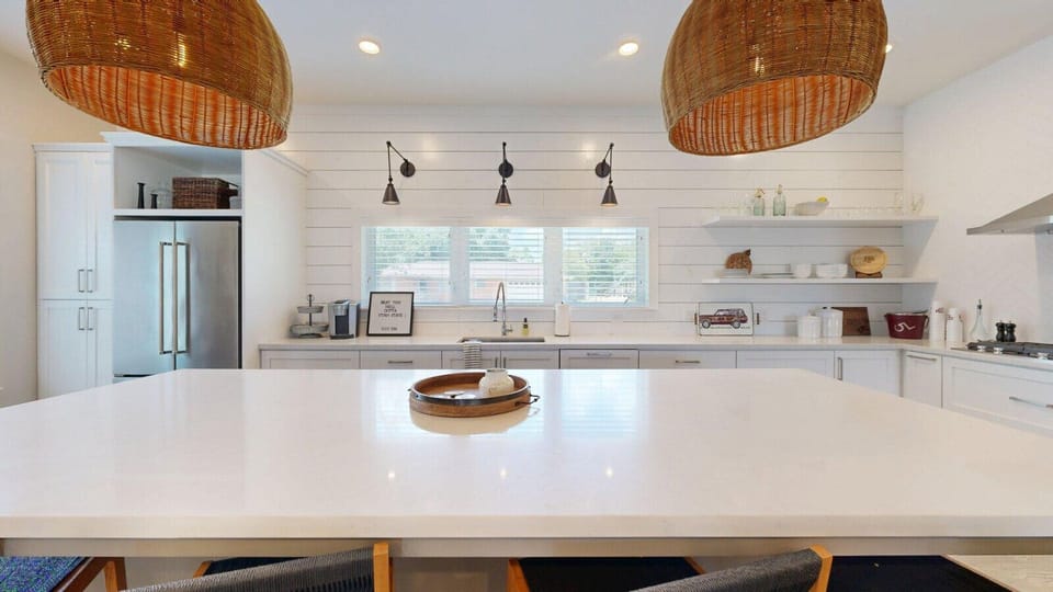 Abundant counter space enhances functionality in the beautifully designed kitchen.