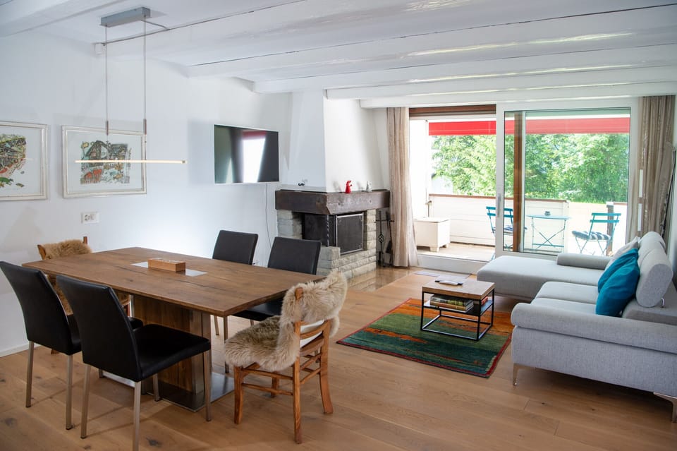 Living area with fireplace and dining table