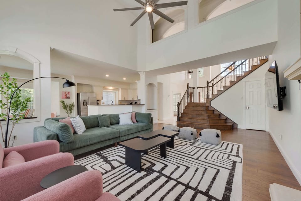 Open-concept living room with spacious layout, velvet seating, and chic design—perfect for lounging and relaxing together.